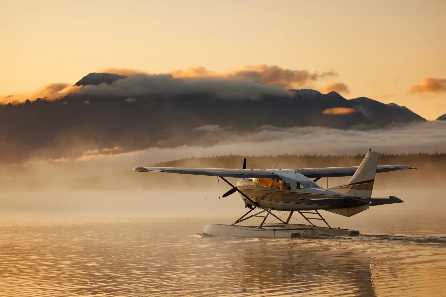 plane-lake-sunset